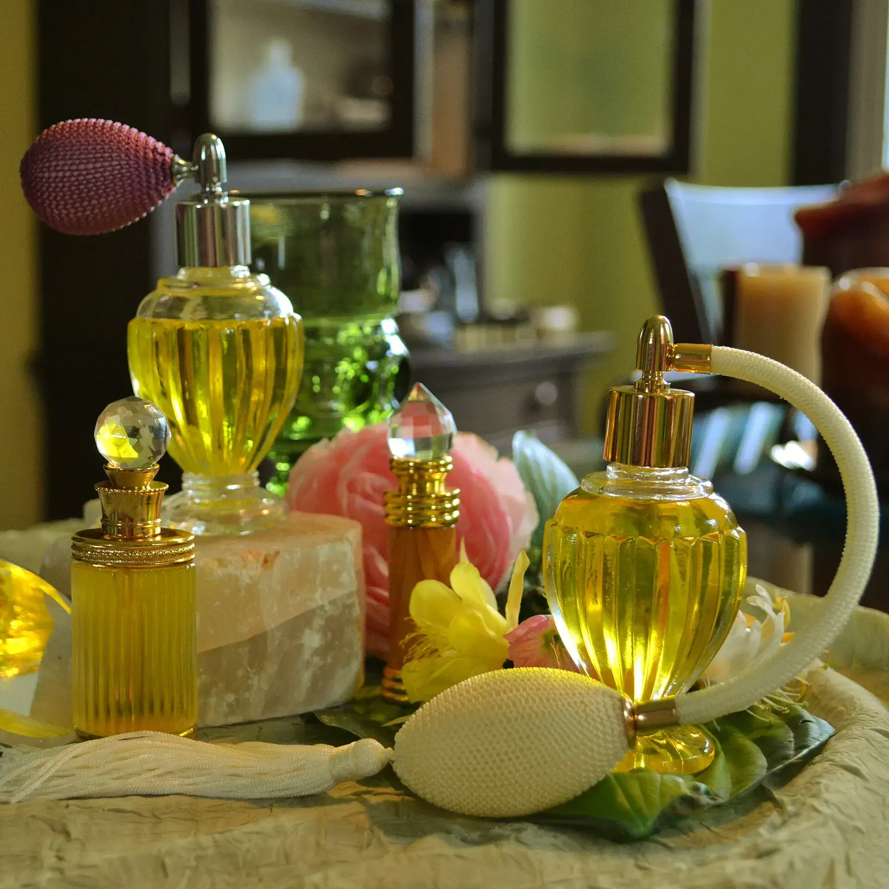 Perfume bottles with atomizers on a dressing table